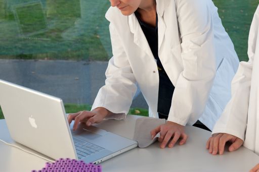 Doctors working with computer